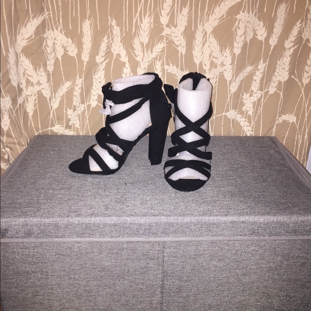 Black suede sandals.